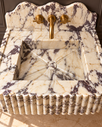 Arabescato Viola fluted marble sink, carving detail