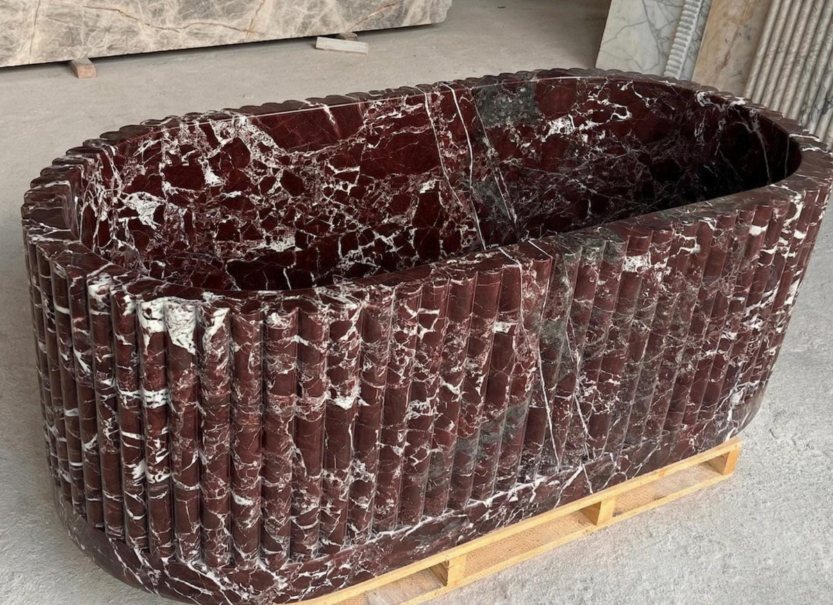 Rosso Levanto fluted burgundy marble freestanding bathtub – close-up