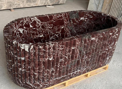 Rosso Levanto fluted burgundy marble freestanding bathtub – close-up
