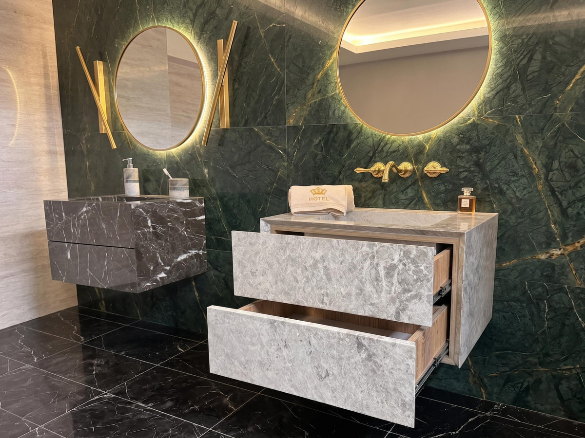 Wall-mounted gray marble vanity with integrated sink and marble drawers