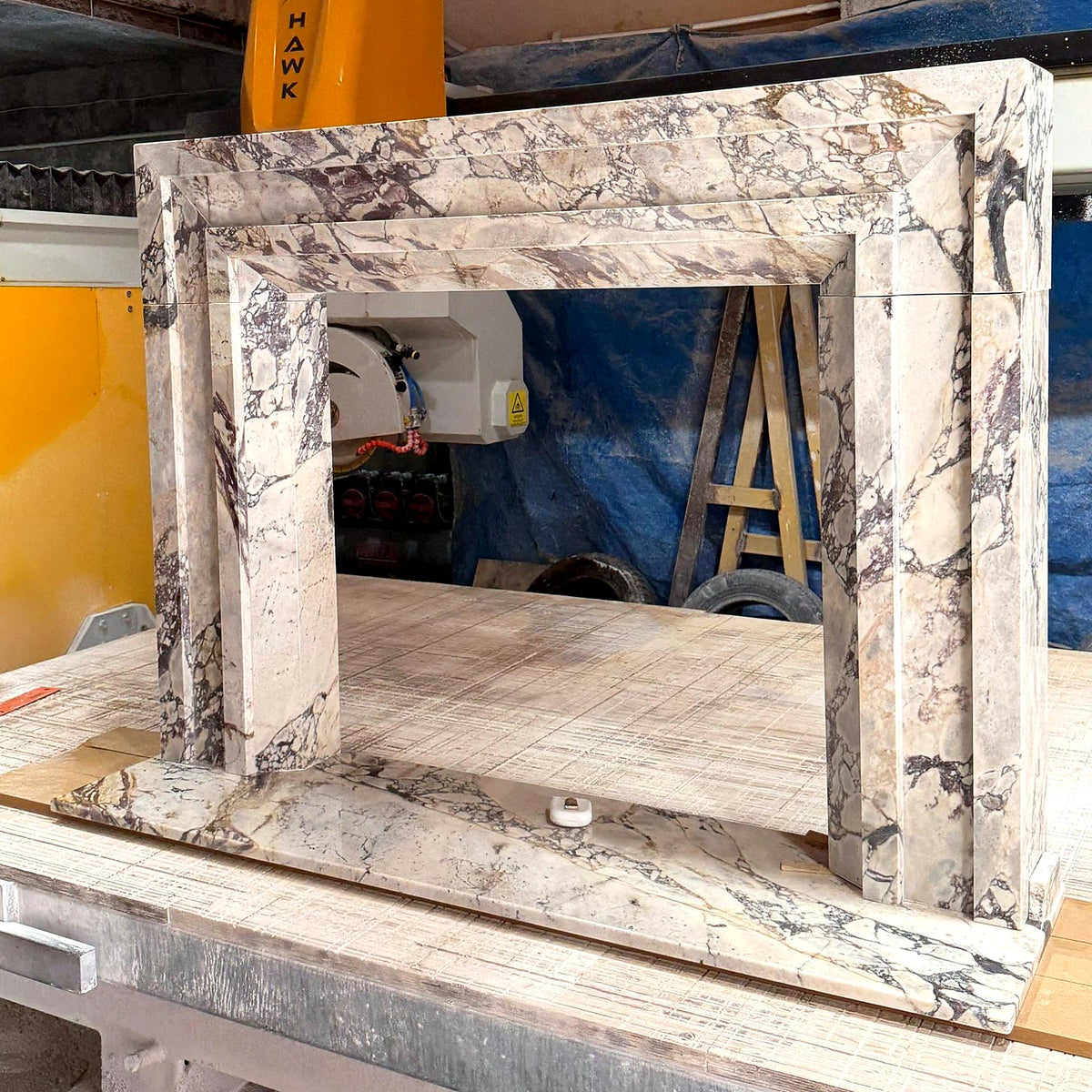 Art Deco Calacatta Viola marble fireplace surround with hearth – workshop view